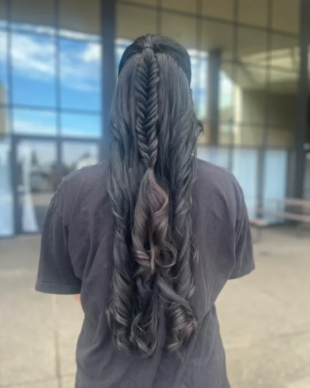 Long dark waves with a central braid and braided side accents.
